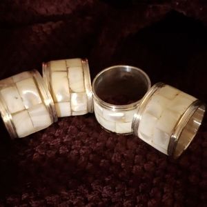Lot of 4 silver and brass napkin  holders with abalone shellinlay.